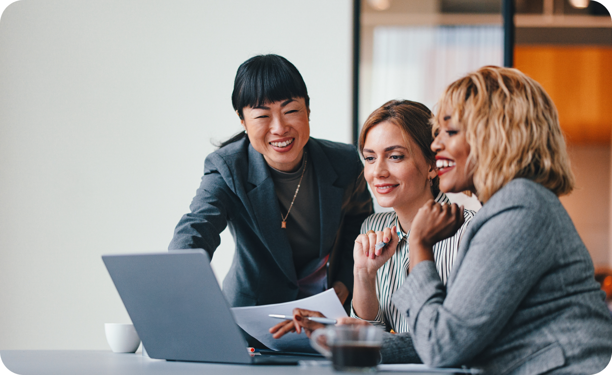 3 women looking at a computer screen